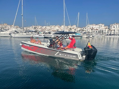 Boat leaving Puerto Banús marina in Marbella